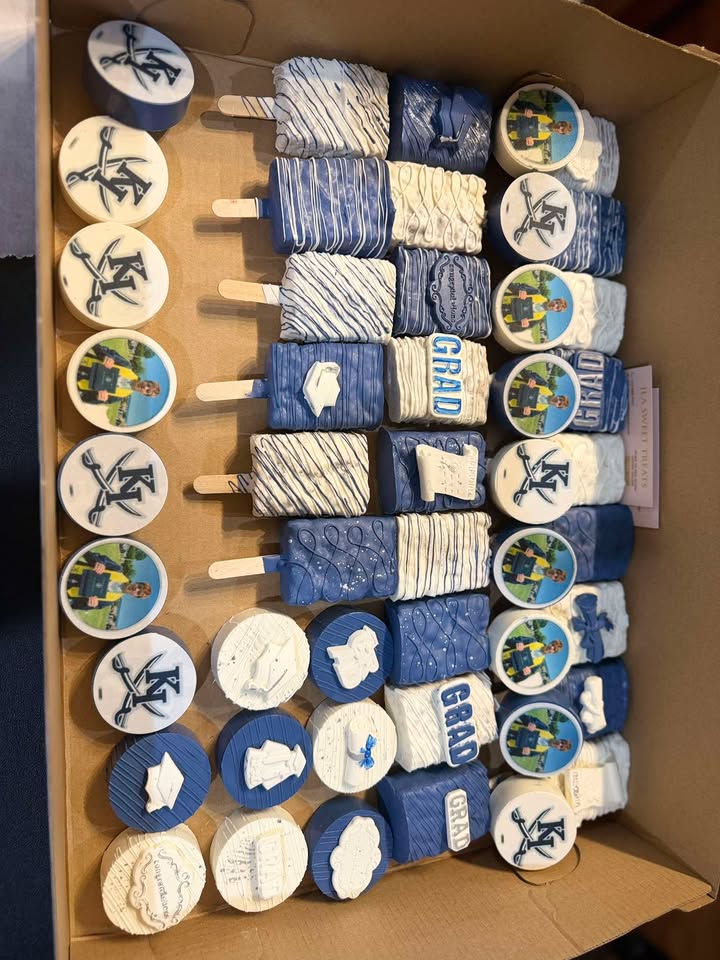 Navy and white graduation treats — cake pops, dipped Oreos and pretzels finished with custom edible images.